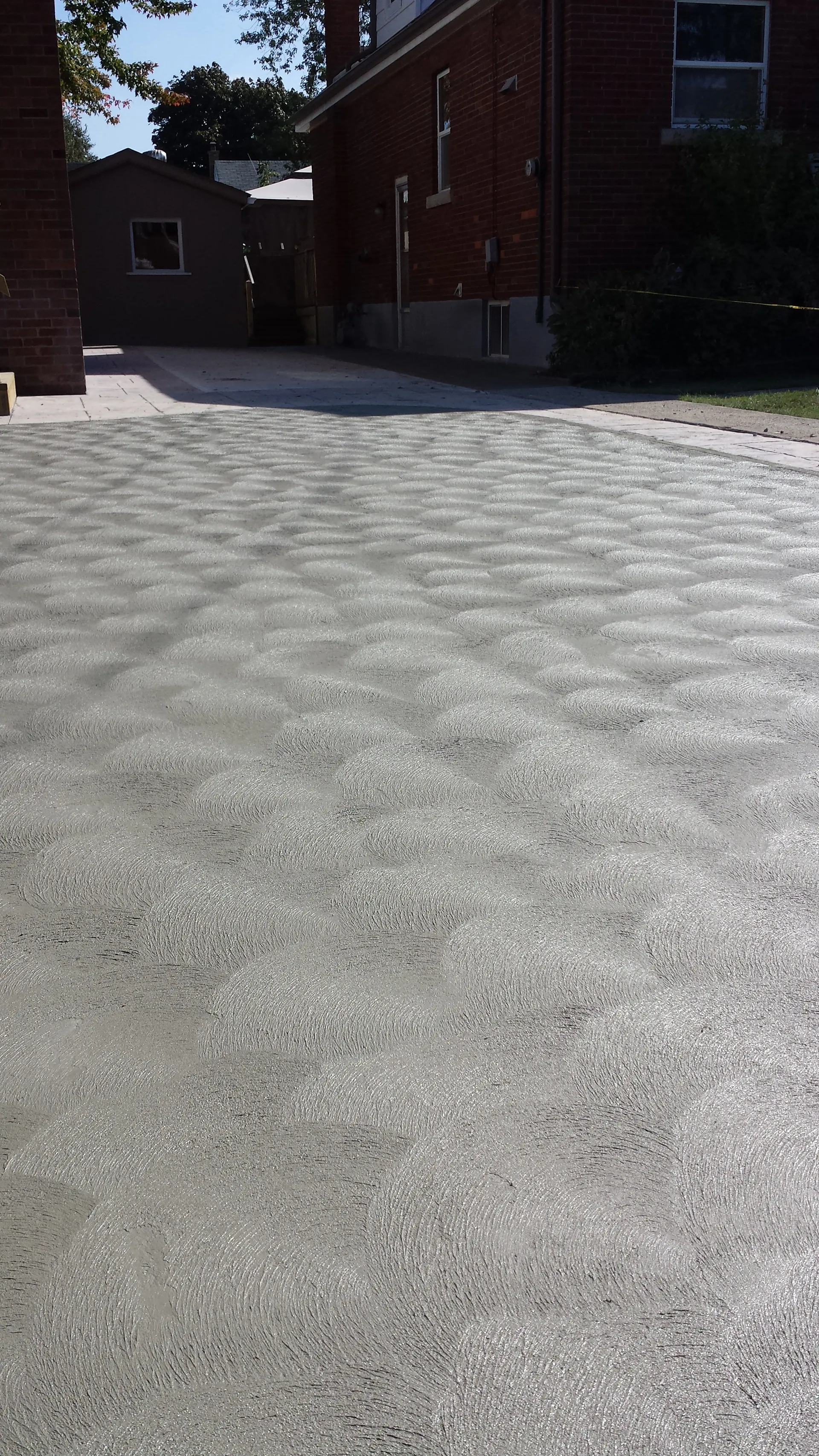 Shimmering spin finish concrete driveway